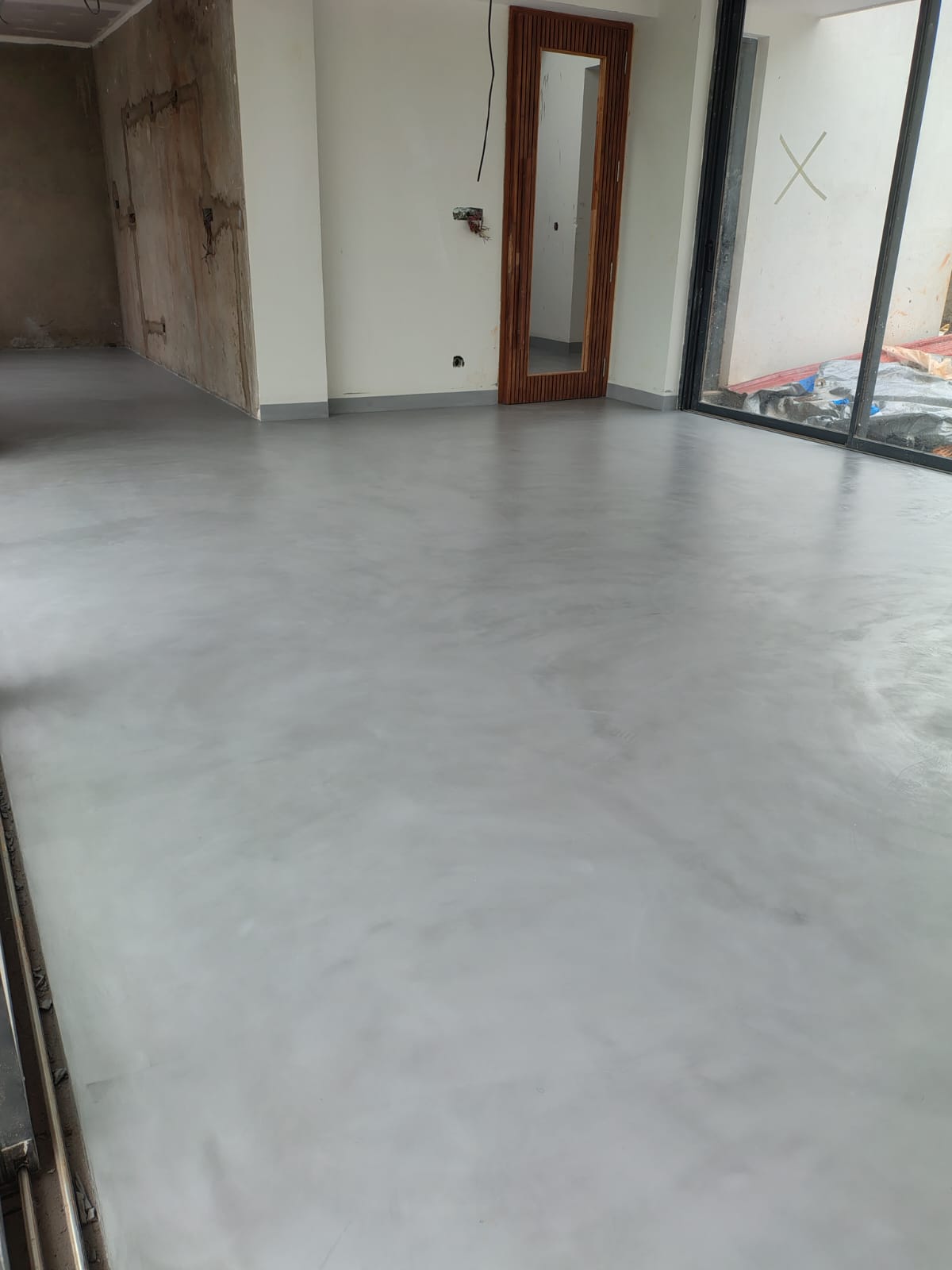 Completed micro concrete floor in a bright interior